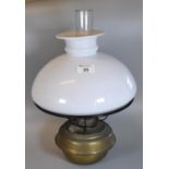 Early 20th Century double oil burner, having opaline glass shade and brass reservoir. (B.P. 21% +