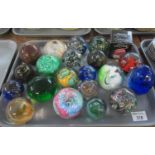 Two trays of assorted art glass paperweights to include Pebble by Caithness, Medina, etc. (2) (B.