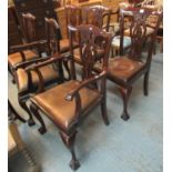 A set of six mahogany Chippendale style dining chairs with leather drop in seats, standing on