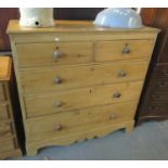 Victorian pine straight front chest of two short and three long drawers with turned handles on a