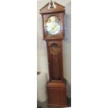 Reproduction mahogany finish longcase clock with brass and silvered dial, Roman numerals with