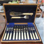 A velvet lined box of fish cutlery, two fish servers and a set of six fish knives and forks with