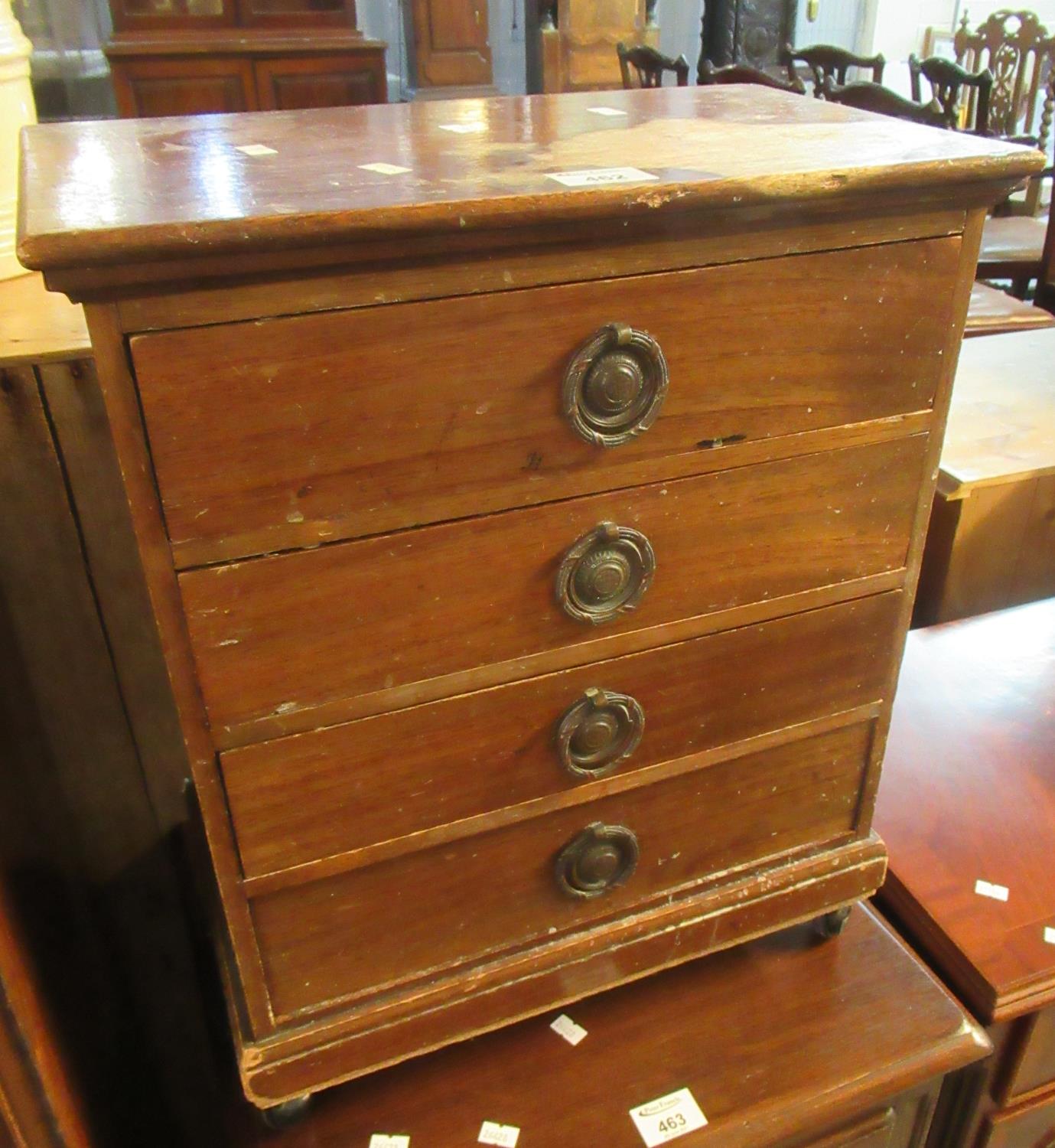 Small distressed mahogany table top straight front chest or collectors cabinet of four drawers on