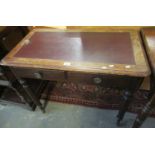 Victorian mahogany writing desk having leather inset top above two fitted drawers on turned tapering