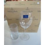 Two plastic boxes comprising Villeroy & Boch wine glasses in original cardboard boxes, varying