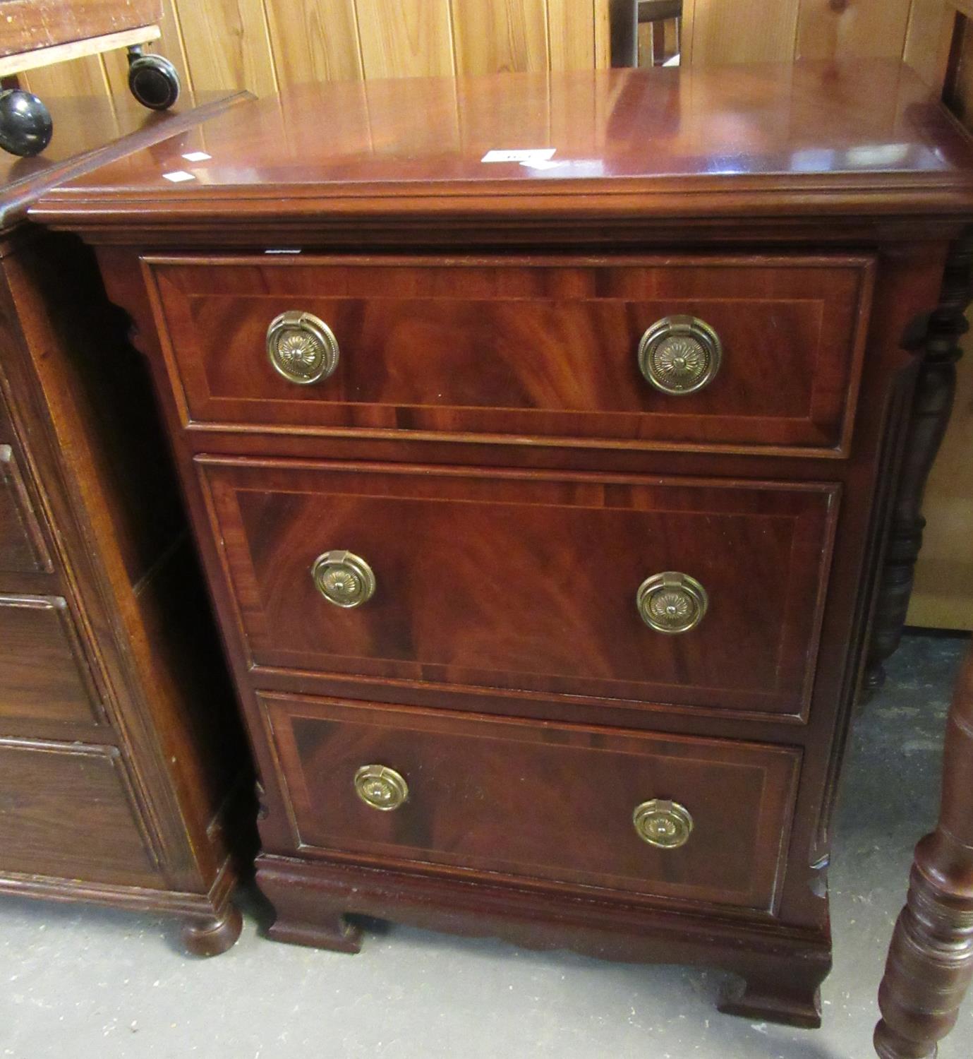 Good quality reproduction flame mahogany chest of three drawers of narrow and small proportions on