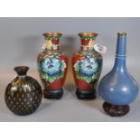 Collection of Chinese style cloisonne baluster vases including a pair with flowers and birds, all on