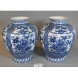 Pair of modern Chinese porcelain blue and white floral and geometric design vases of baluster