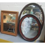 Early 20th Century oak framed and beaded bevel plate mirror. Together with another oval mirror