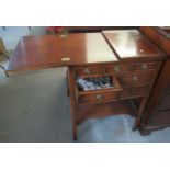 Reproduction mahogany cutlery cabinet or canteen with two opening flaps to the top above an