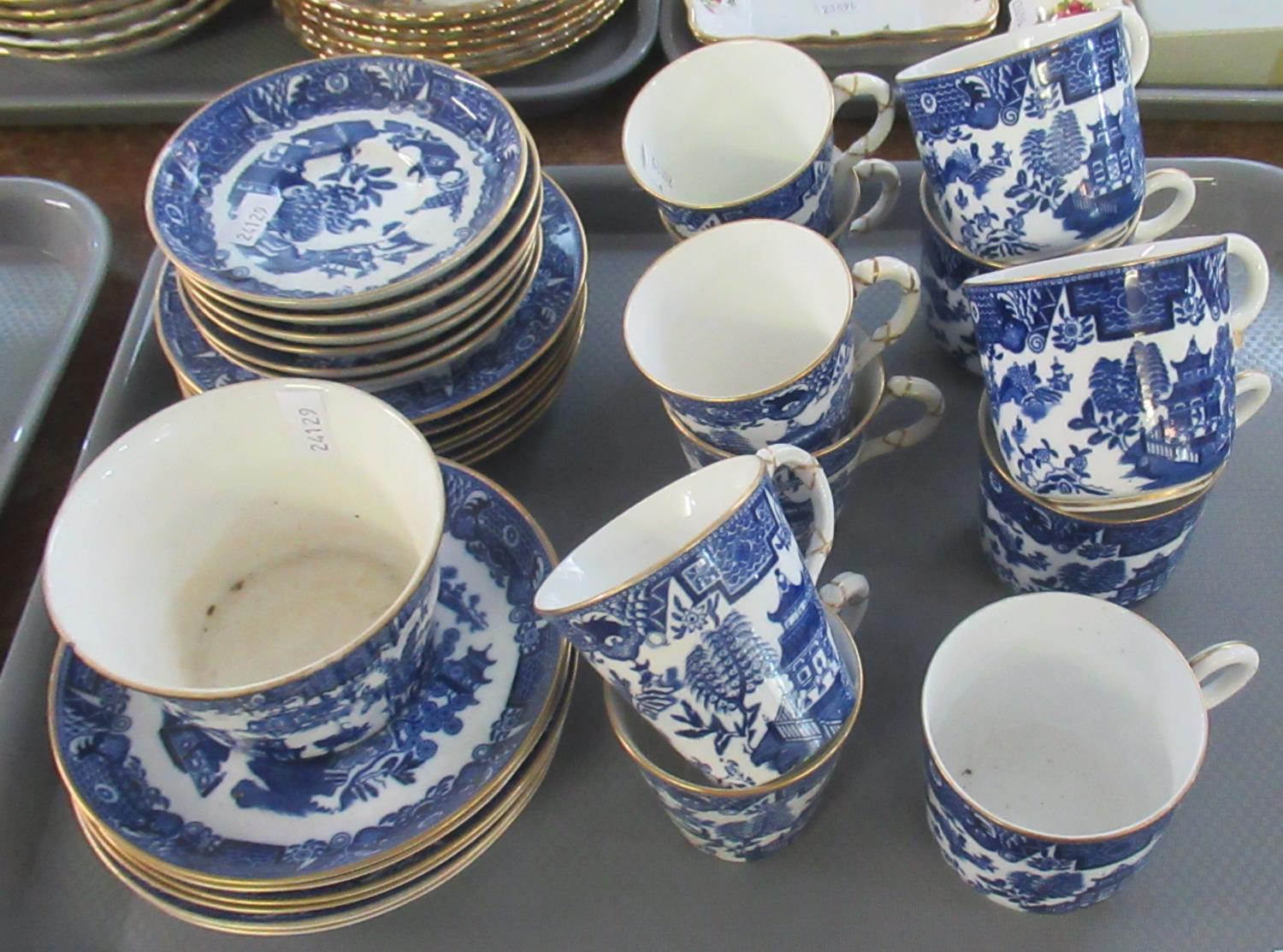 Tray comprising Royal Worcester blue and white oriental design coffee cans and cups with saucers and