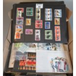 Box with all world selection of stamps on pages, cards, in packets and various covers and first