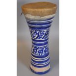 A blue and white ceramic North African or Middle Eastern single drum of waisted form. (B.P. 21% +