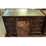 Reproduction mahogany knee hole desk with leather inset top above a bank of three drawers to each