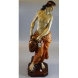 Early 20th Century pottery semi-nude figurine of a water carrier. (B.P. 21% + VAT)