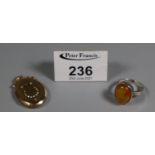 Silver and amber ring and a gold plated (9ct gold 'back and front') locket. (B.P. 21% + VAT)