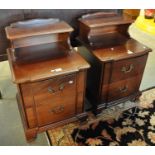 A pair of reproduction mahogany finish bedside cabinets having two drawers on bracket feet. (2) (B.