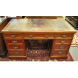 Edwardian mahogany knee hole desk having leather inset top above bank of three drawers to each