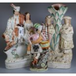 Three 19th Century Staffordshire pottery flat back figure groups and figures, one of a Scotsman in