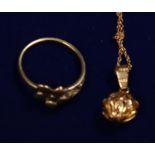 18ct gold pendant and chain and a 9ct gold flower ring. Ring size L&1/2/ Approx weight in total 3.