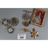 Three WWII medals, a cap badge and a sweetheart brooch, together with two silver medallions each