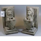 Pair of composite bookends in the form of seated lions with shields. (B.P. 21% + VAT)