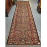 Middle Eastern design multi-coloured runner having stylised floral and foliate decoration. (B.P. 21%