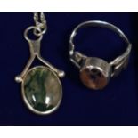 A moss agate pendant and a silver gemset ring. Ring size Q. (B.P. 21% + VAT)