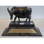 Unusual presentation trophy of a carved water buffalo with plaque 'Philippine bridge festival,