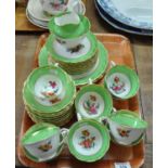 Printed and painted part teaware florally decorated and edged with green and gold comprising: 12