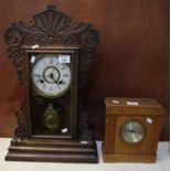 Early 20th Century carved oak architectural probably American two train mantel clock. Together
