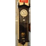 Early 20th Century stained single train Vienna type wall clock with key and pendulum and barley
