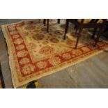 Large cream ground foliate design carpet with stylised floral borders. (B.P. 21% + VAT)