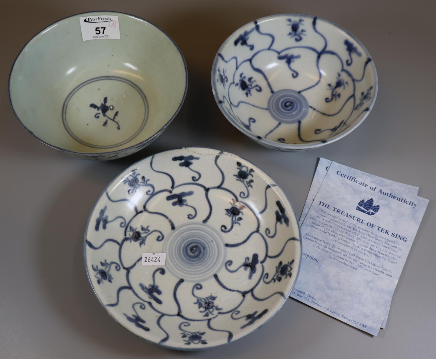 The Treasure of Tek Sing blue and white items to include; a shallow dish and two bowls, all in