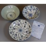 The Treasure of Tek Sing blue and white items to include; a shallow dish and two bowls, all in