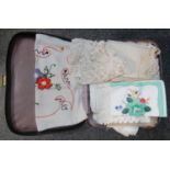 Small 'Classic' black vintage suitcase containing; various applique, embroidered and crochet table