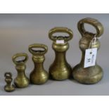 Set of five graduated bell shaped brass weights. (B.P. 21% + VAT)