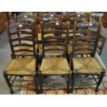 Set of six Lancashire style oak ladder back kitchen chairs on rush seats. (6) (B.P. 21% + VAT)