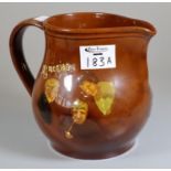 A Royal Doulton single handled jug of baluster form decorated with Victorian figures.