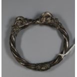 A white metal double goat head bangle. (B.P. 21% + VAT)