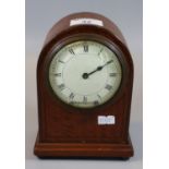 Late 19th/early 20th Century mahogany mantel clock of domed form on bun feet with key. (B.P. 21% +