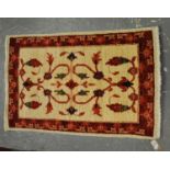 Small cream and red ground foliate runner, 93 x 60cm approx. (B.P. 21% + VAT)