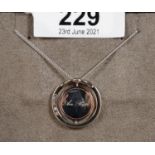A Clogau silver, 'Love Circles' pendant with gold accents. (B.P. 21% + VAT)