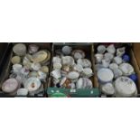 Three boxes of assorted china, largely teacups, saucers and side plates, various makers to