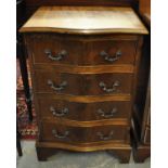 Reproduction mahogany serpentine chest of narrow proportions with four drawers. (B.P. 21% + VAT)