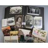 Early 20th Century postcard album containing assorted black and white photographs, portraits, family