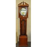 Reproduction mahogany finish longcase clock with brass and silvered dial, Roman numerals with
