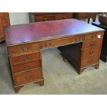 Early 20th Century mahogany knee hole desk with leather inset top and a bank of three drawers to