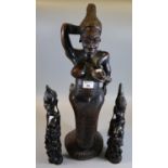 Carved African tribal fertility and mythical figurine, together with a pair of carved tribal