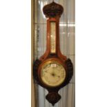 Early 20th Century carved oak aneroid barometer. (B.P. 21% + VAT)